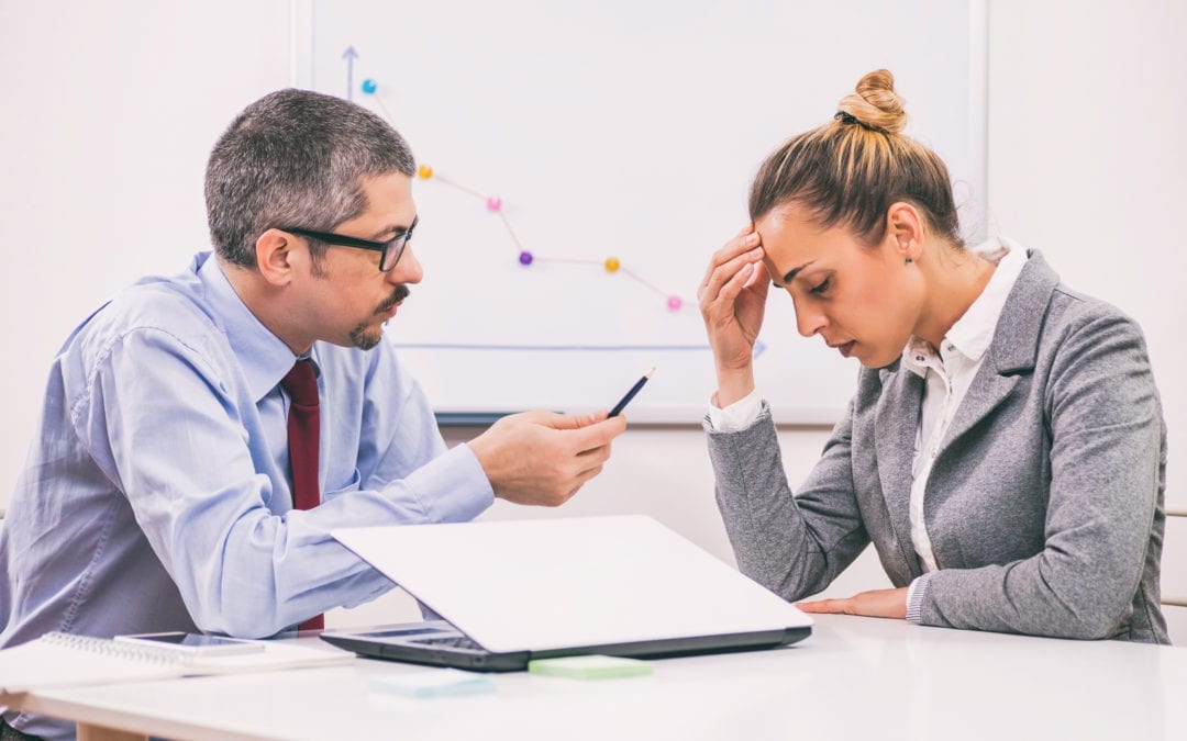Businesswoman is getting fired by her boss.