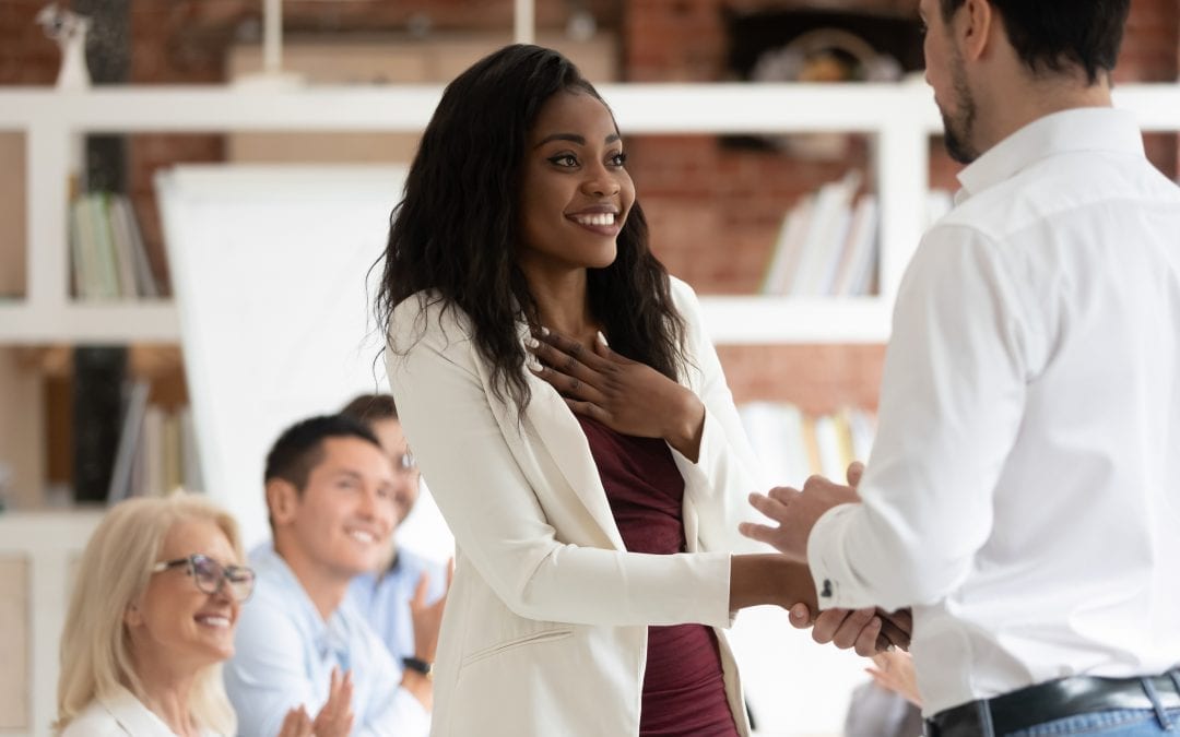 Happy Proud Female Employee Get Rewarded Handshake