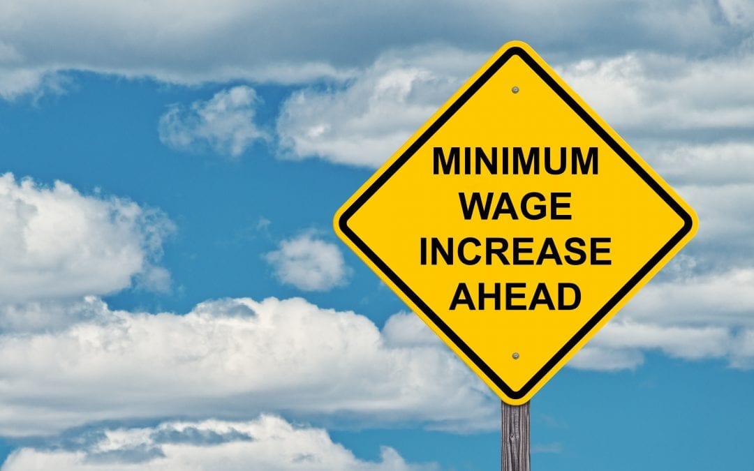 Minimum Wage Increase Ahead Caution Sign Blue Sky Background
