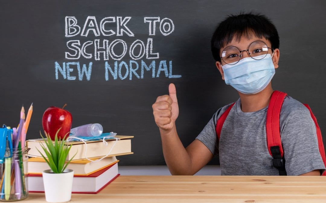 School Boy Wearing Face Mask Thumbs Up Over Blackboard With Text
