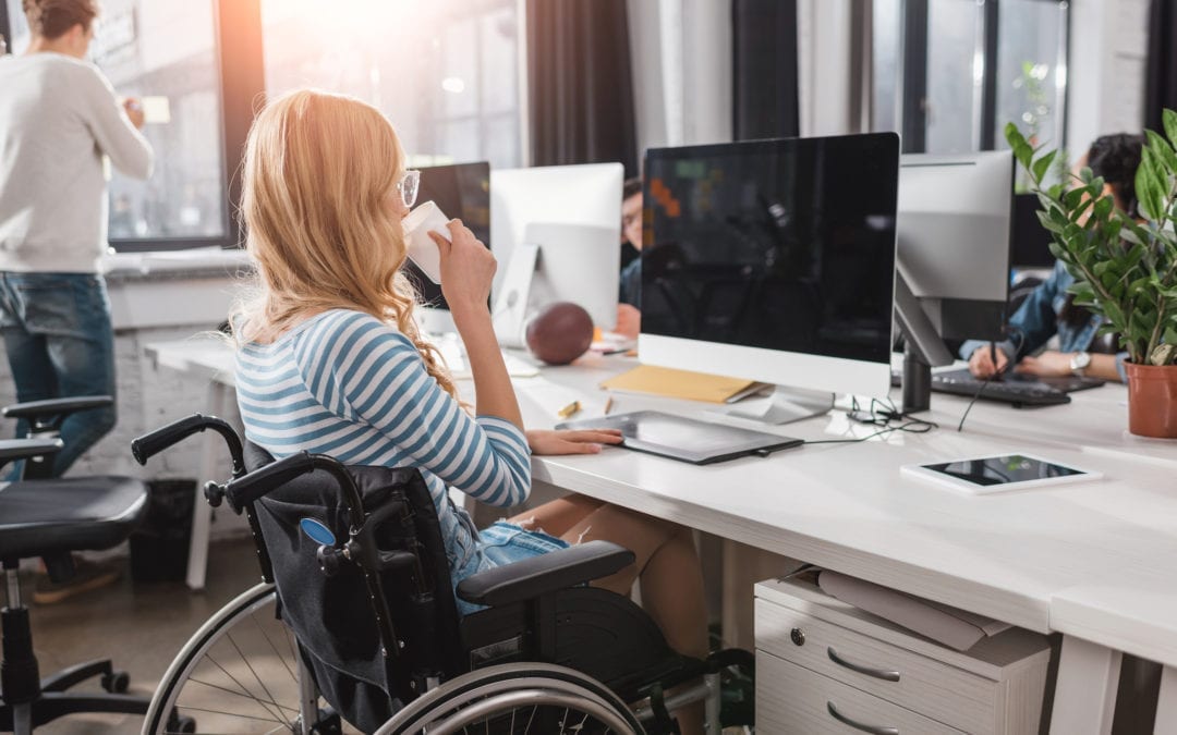 Person in Wheelchair working in Office
